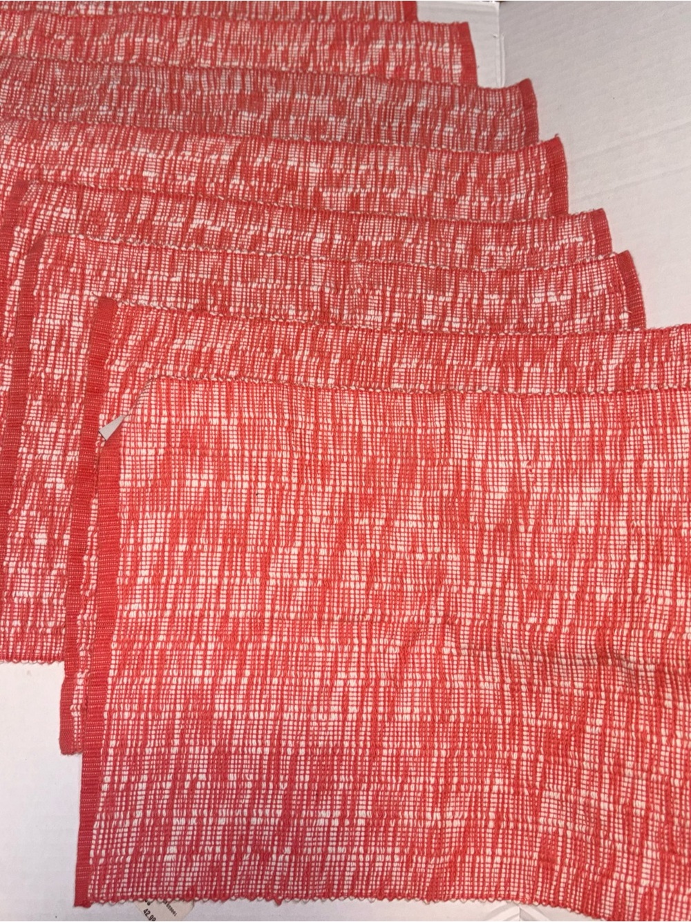 Nicole Miller lot 8 woven placemat featuring a textured coral cream pattern